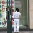 Elvis window shopping outside Versace in Hamburg